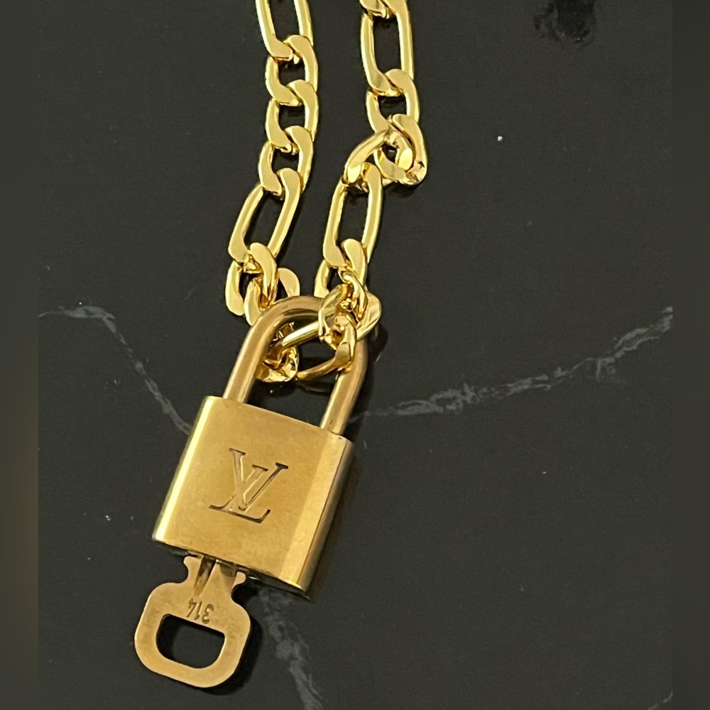 Authentic Louis Vuitton lock and key with chain